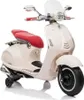 A cream-colored electric scooter for children, with a red seat and black wheels, shown from a side-diagonal angle against a white background. Podgląd zdjęcia produktu