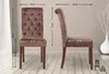 Two views of a brown velvet dining chair with dimensions indicated by measurement lines and text. Voir les images du produit