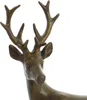 A close-up of a bronze deer figurine's head and antlers. Produktbild-Vorschau
