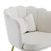 Close-up of a beige velvet chair with a small pillow. Náhled obrázku produktu