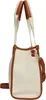 A side view of a cream-colored tote bag with brown trim and straps, presented against a white background. Anteprima dell’immagine prodotto