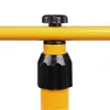 A close-up view of a yellow metal bar with a black knob and a black locking mechanism. The locking mechanism has the words "TO LOCK" and an arrow printed on it. Náhled obrázku produktu