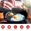 A person is cracking an egg into a cast iron skillet with two eggs already frying. Produktbild-Vorschau