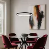 A dining room scene with a table, chairs, and a painting. Anteprima dell’immagine prodotto