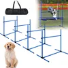 A collage of dog agility equipment, including hurdles and a carrying bag, with a golden retriever puppy in the foreground and a dog jumping over a hurdle in the background. Náhled obrázku produktu