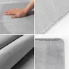 A collage of four close-up images showing the texture and edges of a gray rug. Produktbild-Vorschau
