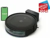 A robot vacuum cleaner, its charging dock, and a smartphone displaying the iRobot app are arranged on a white background. A marketing badge is visible in the upper right corner. Podgląd zdjęcia produktu
