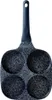 A top-down view of a four-cup egg pan with a dark gray handle. Anteprima dell’immagine prodotto