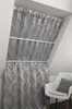 A white chair with a gray cushion is placed next to a window with gray leaf-patterned curtains. Produktbild-Vorschau