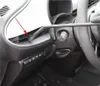 A close-up view of a car's interior, showing a vacuum cleaner attachment being used to clean a crevice near the dashboard. The red arrow indicates the area being cleaned. Produktbild-Vorschau