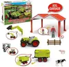 A collection of toy farm vehicles and accessories, including a tractor, trailer, excavator, figures, and a garage structure, presented as a set. Anteprima dell’immagine prodotto