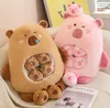 Two plush toy bears, one brown and one pink, are shown on a couch with smaller plush toys inside their bellies and around them. A magazine is placed in front of them. Anteprima dell’immagine prodotto