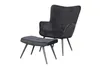 A black velvet armchair and ottoman are shown against a white background. Produktbild-Vorschau