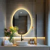 A modern bathroom vanity with a sink, faucet, mirror, and decorative items. Náhled obrázku produktu
