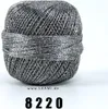 A ball of grey metallic yarn on a white background. Produktbild-Vorschau
