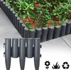 A garden border made of plastic fence posts is installed along a paved walkway next to a flower bed. Náhľad obrázku produktu