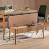 A dining room scene with a wooden table, green chairs, and an open storage bench. Produktbild-Vorschau