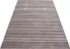 A rectangular rug with a striped, textured pattern is shown from a diagonal, elevated perspective against a white background. Podgląd zdjęcia produktu