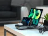 A charging station with multiple devices on a table. Anteprima dell’immagine prodotto