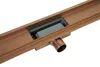 A close-up, studio shot of a linear shower drain with a copper finish. Podgląd zdjęcia produktu