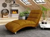 A modern living room with a chaise lounge, fireplace, and plants. Náhľad obrázku produktu