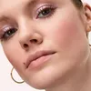 Close-up of a woman's face, focusing on her eye makeup and cheek. Podgląd zdjęcia produktu