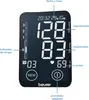 A digital blood pressure monitor display with labels pointing to different readings and functions. Náhled obrázku produktu