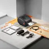 A product shot of a label printer and its accessories arranged on a multi-level platform. Podgląd zdjęcia produktu