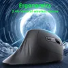 A dark, futuristic background with glowing blue lines and a large, bright sphere, behind a black vertical wireless mouse. Produktbild-Vorschau