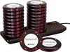 A set of restaurant pagers and their charging base. Produktbild-Vorschau