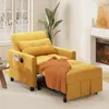 A yellow convertible sofa bed with an orange throw blanket and a pillow is shown in a living room setting with a fireplace and a window. Podgląd zdjęcia produktu