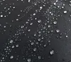 Close-up of water droplets on a black fabric surface. Produktbild-Vorschau