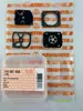 A product packaging with several carburetor repair kit parts laid out on it, with a small plastic container in the foreground. Voir les images du produit
