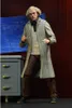 A figure of Doc Brown from Back to the Future standing in a lab-like setting with blueprints. Náhled obrázku produktu