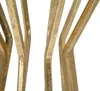 A close-up view of several golden metal legs of a table. Produktbild-Vorschau