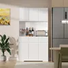 A white kitchen cabinet with bottles and a microwave on top, next to a refrigerator and a dining table. Produktbild-Vorschau