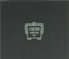 A close-up of a black box with a light-colored logo and text. Náhľad obrázku produktu