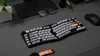 A desk setup with a keyboard, mouse, glasses, and a plant. Produktbild-Vorschau