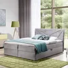 A bedroom scene with a bed, lamp, and window. Produktbild-Vorschau