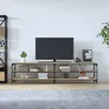 A TV stand with a television and decorative items in a room. Produktbild-Vorschau