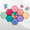 A collection of colorful magnetic tiles arranged on a white wooden surface. Anteprima dell’immagine prodotto