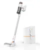 A cordless vacuum cleaner with its charging and dust collection station, presented in a studio setting. Produktbild-Vorschau