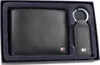 A black leather wallet and keychain set in a dark blue box. Náhľad obrázku produktu