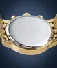 The back of a gold-colored watch with a silver case is shown against a blue background. Produktbild-Vorschau