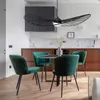 A dining area with a table and chairs, a chandelier, and kitchen cabinets in the background. Podgląd zdjęcia produktu
