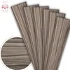A close-up view of several wood-patterned panels fanned out, with a circular inset showing a magnified view of the wood grain. Anteprima dell’immagine prodotto