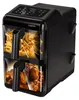 A black dual-chamber air fryer with food visible in both chambers. Náhled obrázku produktu