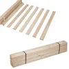 A stack of wooden bed slats and a separate set of wooden bed slats arranged in a row, all on a white background. Produktbild-Vorschau