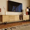 A modern living room with a TV mounted on the wall above a wooden TV stand. Voir les images du produit