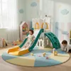 Children playing on a multi-level indoor playground in a brightly decorated room. Náhľad obrázku produktu